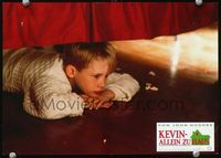 4e619 HOME ALONE German movie lobby card '90 great image of Macaulay Culkin hiding under bed!
