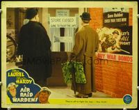 4f383 AIR RAID WARDENS LC '43 Laurel & Hardy outside their store that is closed & ultra patriotic!