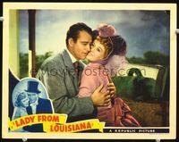 4f726 LADY FROM LOUISIANA LC '41 close up of John Wayne in suit & tie holding pretty Ona Munson!