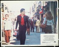 4f874 SATURDAY NIGHT FEVER R-rated LC #5 '77 Travolta strutting down street to the music of Stayin' Alive!