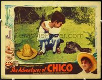5f321 ADVENTURES OF CHICO LC '38 close up of young Mexican boy crouching by dead bird!