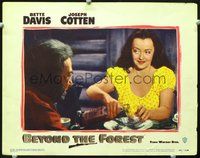 5f370 BEYOND THE FOREST LC #8 '49 bad Bette Davis pouring a drink of liquor at dinner table!