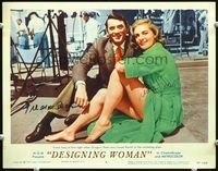 5f017 DESIGNING WOMAN signed LC #4 '57 by both Gregory Peck & Lauren Bacal, sitting by swimming pool