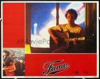 5f489 FAME int'l LC #3 '80 close up of young Paul McCrane with lots of hair practicing his guitar!