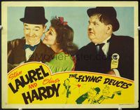 5f504 FLYING DEUCES LC '39 Oliver Hardy is jealous of Stan Laurel, who gets the pretty girl!