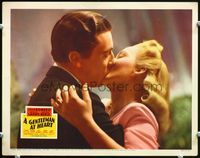 5f517 GENTLEMAN AT HEART LC '42 close up of bookie Cesar Romero kissing pretty Carol Landis!
