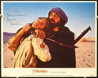 5f054 SAHARA signed LC#6 '84 by Brooke Shields, who's being held captive by John Rhys-Davies!
