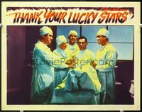 5f914 THANK YOUR LUCKY STARS LC '43 Eddie Cantor is a most unwilling patient in the operating room!
