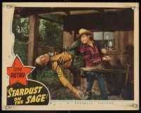 6f036 STARDUST ON THE SAGE signed LC '42 by Gene Autry, who's close up punching bad guy over rail!