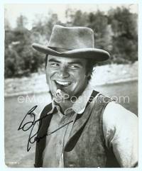7f025 BURT REYNOLDS signed 8x10 still '69 great close up with cigar in mouth from Sam Whiskey!