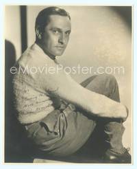 7f041 FREDRIC MARCH signed deluxe 7.75x9.5 still '40s seated close up with arms wrapped around legs!