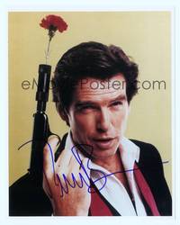 7f200 PIERCE BROSNAN signed color repro 8x10 '00 best close up holding gun with flower in barrel!