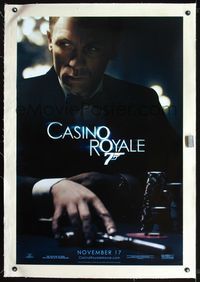 7w082 CASINO ROYALE linen teaser 1sh '06 Daniel Craig as James Bond sitting at poker table w/gun!