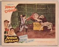 8j029 AFRICA SCREAMS LC #2 '49 Clyde Beatty in cage holding off two lions with chair & whip!