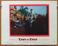 8j233 EAST OF EDEN LC '55 concerned James Dean running past sitting men, John Steinbeck, Kazan!