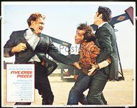 8j273 FIVE EASY PIECES LC #2 '70 Jack Nicholson being beaten up by two men by oil well, Rafelson