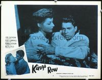 8j429 KINGS ROW LC #6 R56 Ann Sheridan holds Ronald Reagan who asks Where's the rest of me!