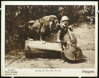 8j658 ROUGHEST AFRICA LC '23 real life lion comes from his lair for Stan Laurel's cello!