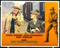 8j751 TRAIN ROBBERS LC #1 '73 close up of John Wayne & Ann-Margret standing by train!
