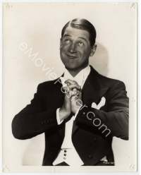 9g299 MAURICE CHEVALIER 8x10 still '30s in tuxedo with clasped hands smirking & looking up!