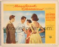 9k329 MAGNIFICENT OBSESSION LC #6 '54 Jane Wyman holding hands with Rock Hudson on beach!