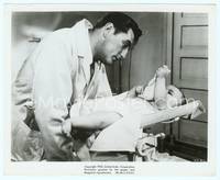 9y351 NOT AS A STRANGER 8x10 still '55 would-be doctor Robert Mitchum looks at baby on scale!