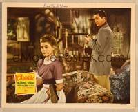 1d009 CLAUDIA signed LC '43 by pretty Dorothy McGuire, who's shining Robert Young's shoes!