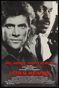 1w460 LETHAL WEAPON 1sh '87 great close image of cop partners Mel Gibson & Danny Glover!