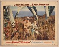 1z531 SEA CHASE LC #1 '55 John Wayne & Lana Turner walking through brush by the oceanside!