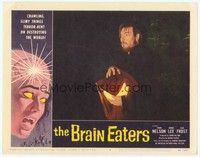 3a290 BRAIN EATERS LC #8 '58 close up of man holding glowing brain concealed under cloth!