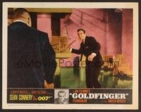 3d390 GOLDFINGER LC #4 '64 Sean Connery as James Bond about to throw stick at Harold Oddjob Sakata!