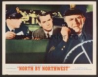 3d482 NORTH BY NORTHWEST LC #8 R66 Cary Grant in back of police car wants to go to jail, Hitchcock