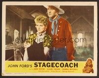 3d594 STAGECOACH LC #4 R48 great close up of big John Wayne holding pretty Claire Trevor!