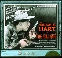 3e167 TOLL GATE glass slide '20 great close image of cowboy William S. Hart holding two guns!