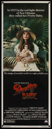 3g290 PRETTY BABY insert '78 directed by Louis Malle, young Brooke Shields sitting with doll
