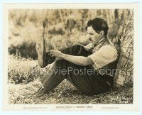 3r284 MODERN TIMES 8x10 still '36 close up of Charlie Chaplin leaning against tree tying his shoe!