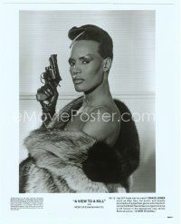 3r469 VIEW TO A KILL 8x10 still '85 super close up of Grace Jones in fur holding gun!