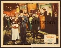 4k049 ARIZONA TO BROADWAY LC '33 James Dunn & Joan Bennett drink pop while walking at carnival!