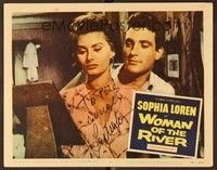 5g080 WOMAN OF THE RIVER signed LC #8 '57 by Sophia Loren, who's in close up looking at a picture!