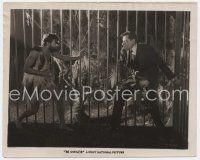 6a492 SAVAGE 8x10 still '26 great close up of fierce caveman Ben Lyon scaring man in cage!