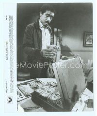 6a519 SOME KIND OF HERO 8x10 still '82 c/u of Richard Pryor counting lots of cash in briefcase!