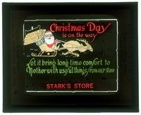 6b200 STARK'S STORE glass slide '20s Christmas Day is on the way, Santa riding on his sleigh!