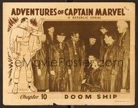 6d127 ADVENTURES OF CAPTAIN MARVEL chapter 10 LC '41 large crowd of men in raincoats surround woman
