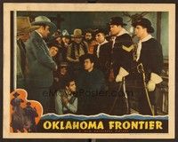 6d495 OKLAHOMA FRONTIER LC '39 Johnny Mack Brown surrounded by large crowd helps wounded man!