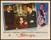 6d579 STRANGER LC '46 Edward G. Robinson shows a piece of paper to Loretta Young by projector!