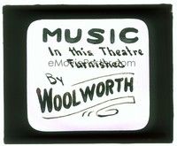 6e133 MUSIC IN THIS THEATRE glass slide '20s is furnished by Woolworth!