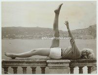 6k457 MARIE CLAIRE 7.25x9.5 still '30s sexy French actress laying on railing by the Riviera!