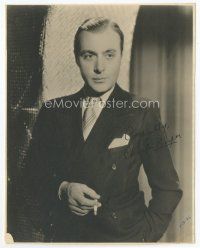 7c022 CHARLES BOYER signed deluxe 7.5x9.5 still '36 standing smoking portrait wearing suit & tie!