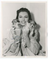 7c032 CYD CHARISSE signed deluxe 8x10 still '54 playing with her Collie pups while making Brigadoon
