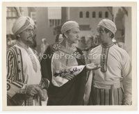 7c045 DOUGLAS FAIRBANKS JR signed 8x10 still '47 in Arab garb between 2 men from Sinbad the Sailor!